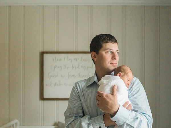 A classic photo of a dad with his newborn son taken by j. photography in Clarksville, TN