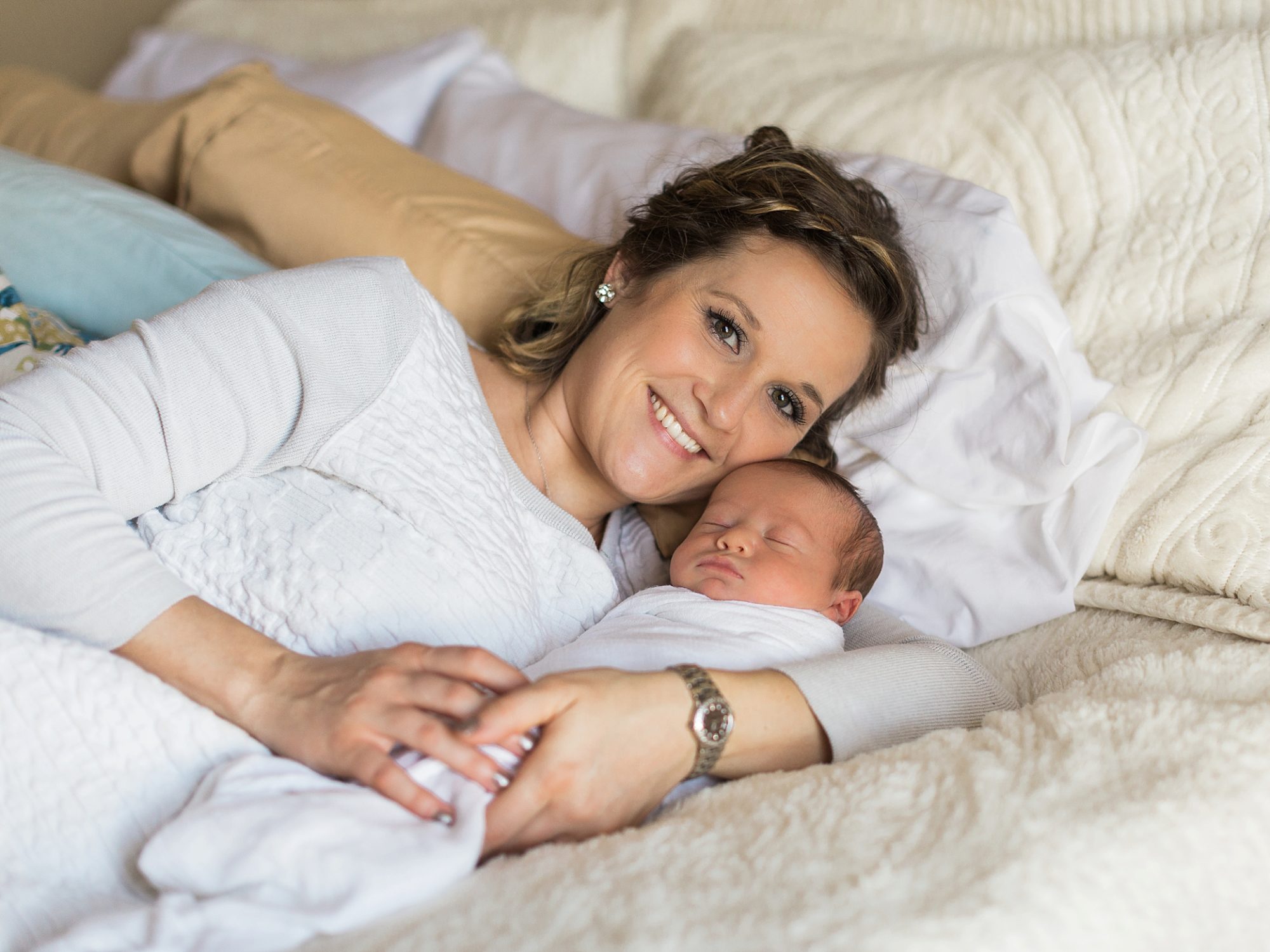 a beautiful portrait of a new mother with her new baby boy taken by j. photography in Clarksville, TN