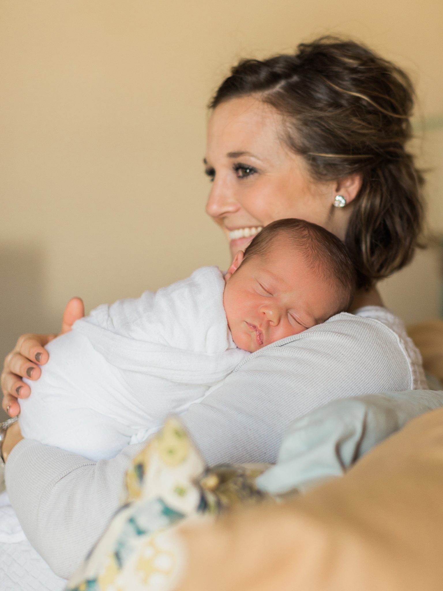 A sweet photo taken during an in home lifestyle newborn session by j. photography 