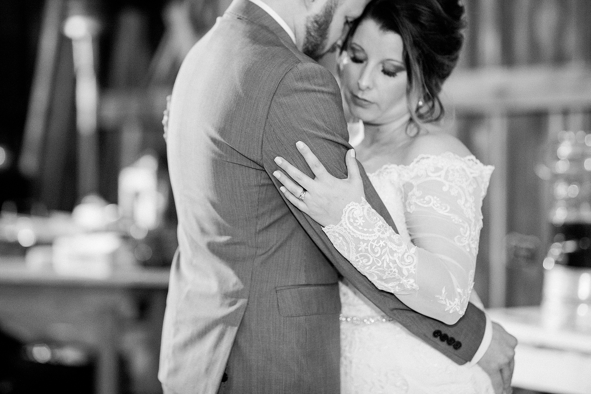 photo of a husband and wife's first dance at their wedding in black and white photographed by j. photography, a wedding photographer in Clarksville, TN